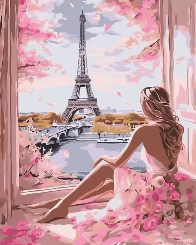 Femme en robe rose admirant la Tour Eiffel